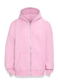 Light pink zip-up hoodie with a large hood, front pockets, and ribbed cuffs. Soft fabric with a smooth texture. Silver hardware detail on the zipper.