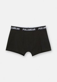 Črne bombažne bokserice s prilagojenim dizajnom, ki imajo beli elastični pas z blagovno znamko, na katerem je napis "PULL&BEAR." Gladka tekstura in brez vzorcev.