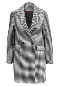Cappotto in fantasia houndstooth bianco e nero con revers a punta, doppio petto, due tasche frontali e foderato in nero.