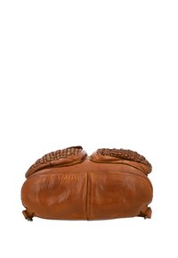 Brown leather handbag shown from the bottom with two woven leather accent pockets on top against a white background.