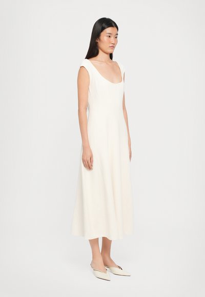 White, sleeveless midi dress with a scoop neckline and fitted bodice, flaring out from the waist. Smooth texture, minimalist design.