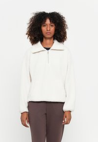 Fleece pullover in off-white, met een ritskraag, brede kraag en een relaxte pasvorm. Heeft lange mouwen en een soepele textuur.