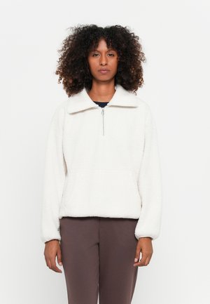 Fleece pullover in off-white, met een ritskraag, brede kraag en een relaxte pasvorm. Heeft lange mouwen en een soepele textuur.