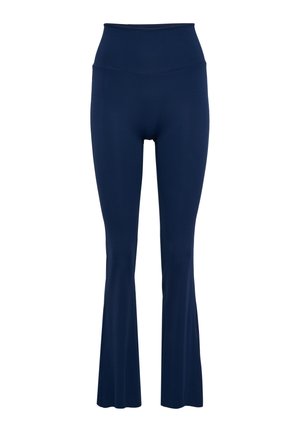 Marineblauwe uitlopende leggings met hoge taille, gemaakt van glad, stretchmateriaal met een naadloze tailleband en subtiele stiksel details.