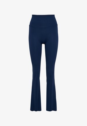 Marineblauwe uitlopende leggings met hoge taille, gemaakt van glad, stretchmateriaal met een naadloze tailleband en subtiele stiksel details.