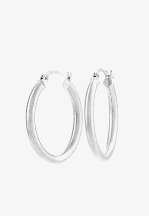 Sudraba krāsas apli auskari ar gludu, noapaļotu dizainu. Katram auskaram ir locāms aizdare, kas nodrošina drošu nēsāšanu.