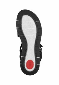 Suela de goma negra con acentos blancos y rojos, patrón de agarre texturizado y forma redondeada; presenta un marcador de talla "37".
