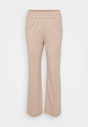 Lys beige bukser med elastisk liv, i en afslappet pasform. Har lodrette sømme og et blødt, glat stof. A-formet design.