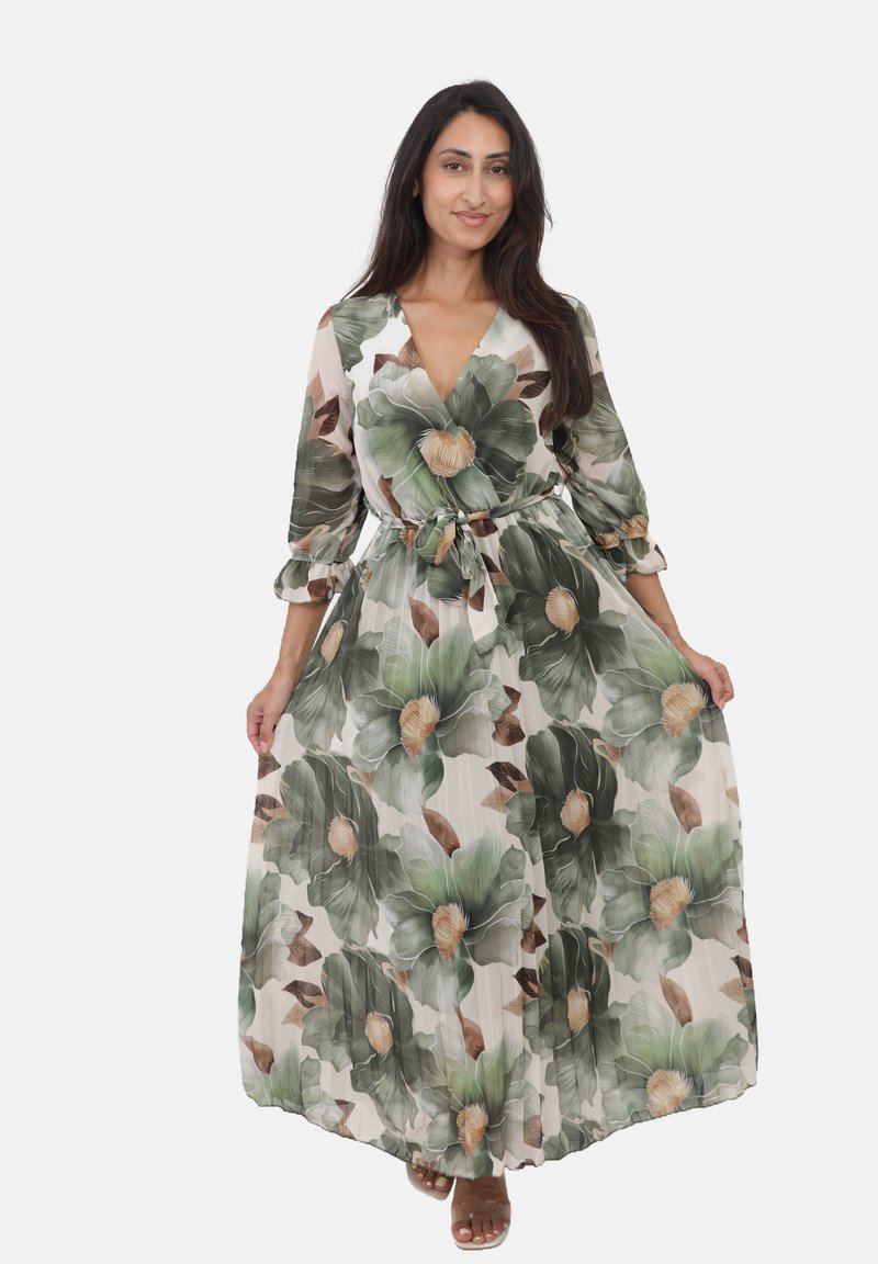 Robe maxi avec un décolleté en V profond, des manches longues et un motif floral comportant des feuilles vertes et des fleurs beiges, cintrée à la taille.