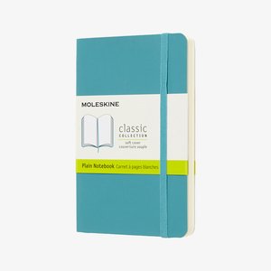 Turquoise soft cover Moleskine classic collection plain notebook with elastic band and label in English and French.
