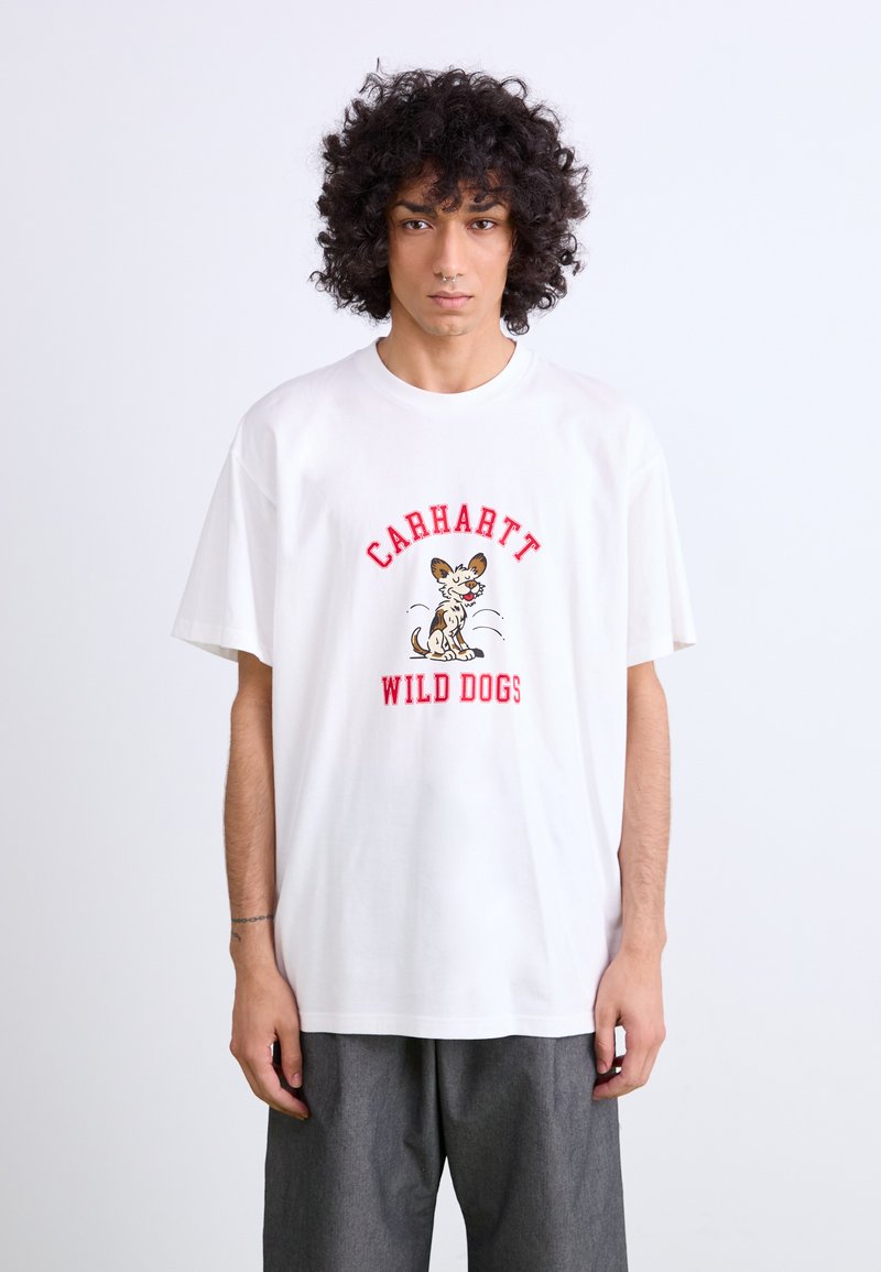 White cotton t-shirt with short sleeves, featuring a colorful "Carhartt Wild Dogs" graphic and a cartoon dog design in the center.
