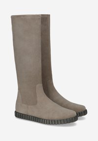 Tall, taupe suede boots with a rounded toe, elastic side panels, and a textured, dark rubber sole. Smooth matte finish, minimal detailing.