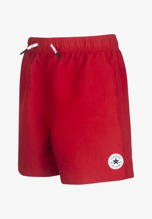 Piros, könnyű sportnadrág, rugalmas derékrésszel, fekete húzózsinórokkal és kerek, fehér logóval a bal alsó lábszáron.
