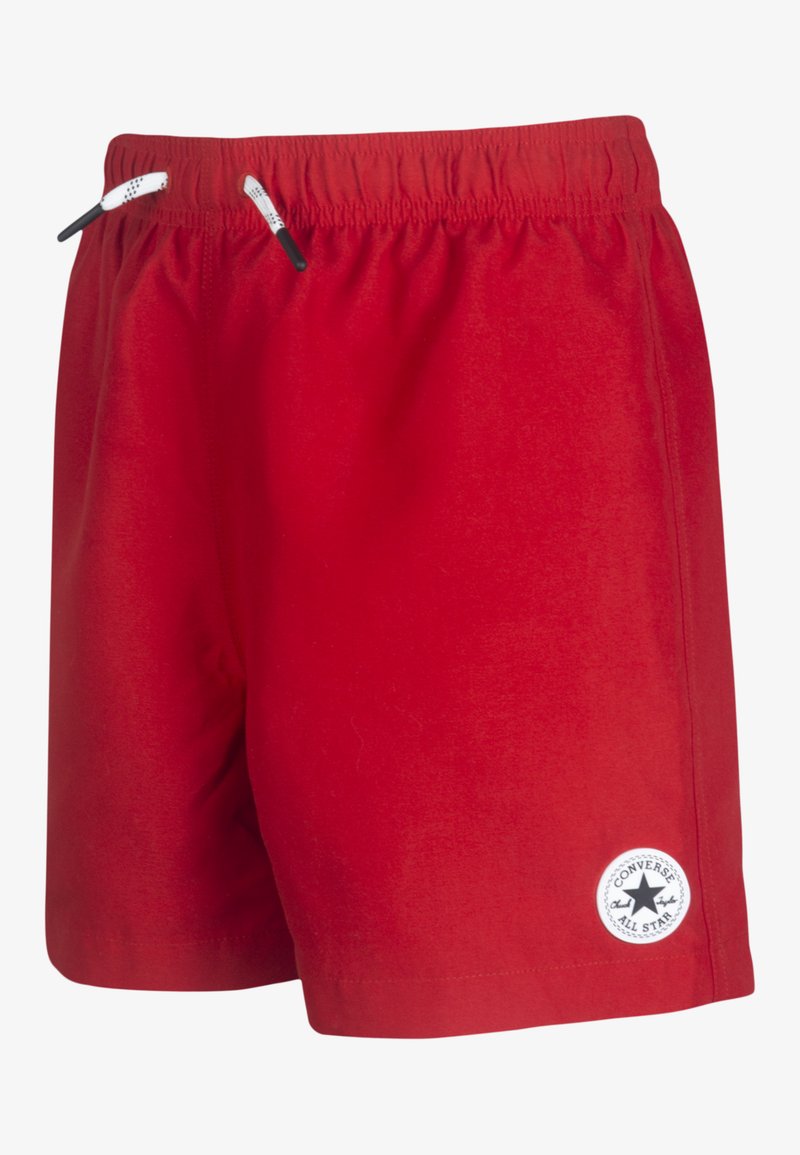 Røde, letvægts shorts med elastisk talje, der har sorte snoretræk og et rundt hvidt logo mærke på den nederste venstre ben.