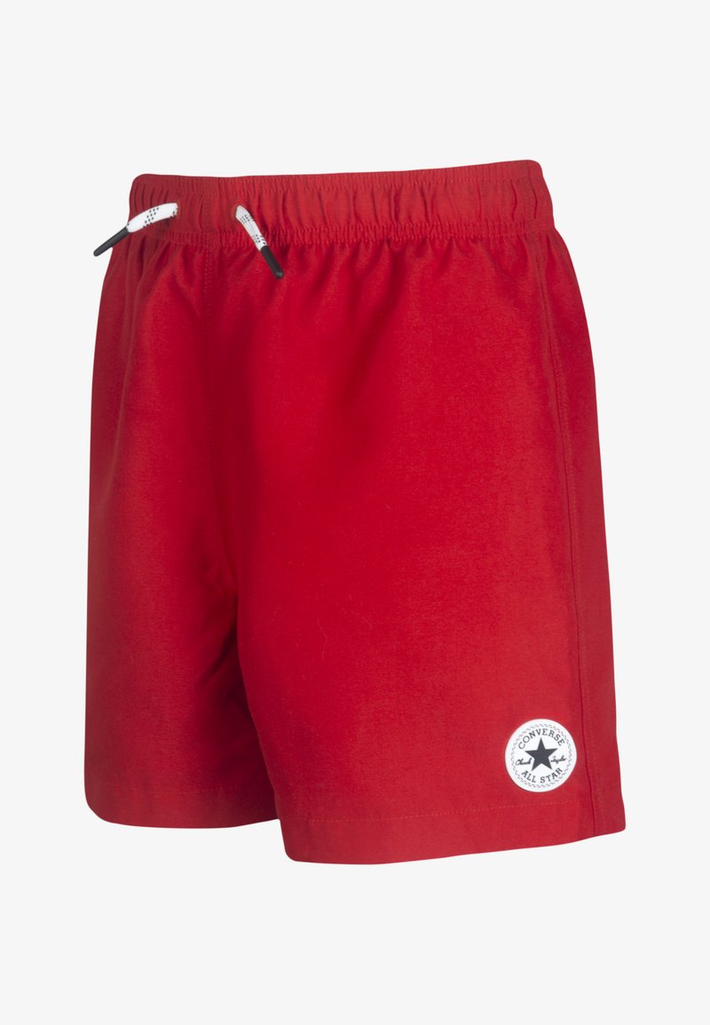 Sarkani, viegli šorti ar elastīgu jostasvietu, ar melnām auklām un apaļu baltu logo uzlīmi kreisajā apakšējā kājā.