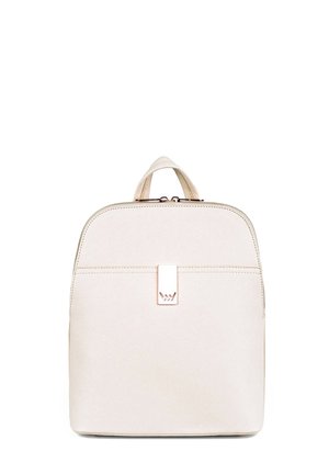 Beige backpack made of textured material, featuring a rounded top, a front zip pocket, and a metal clasp with a logo accent.