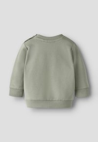 Jasnozielona bluza z długimi rękawami, ściągaczami na mankietach i dole, gładką teksturą oraz zatrzaskami na ramionach dla łatwego ubierania.