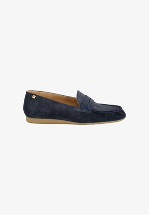 Navy blue suede loafer with tan interior, flat tan sole, decorative stitching, and small gold logo on the heel.