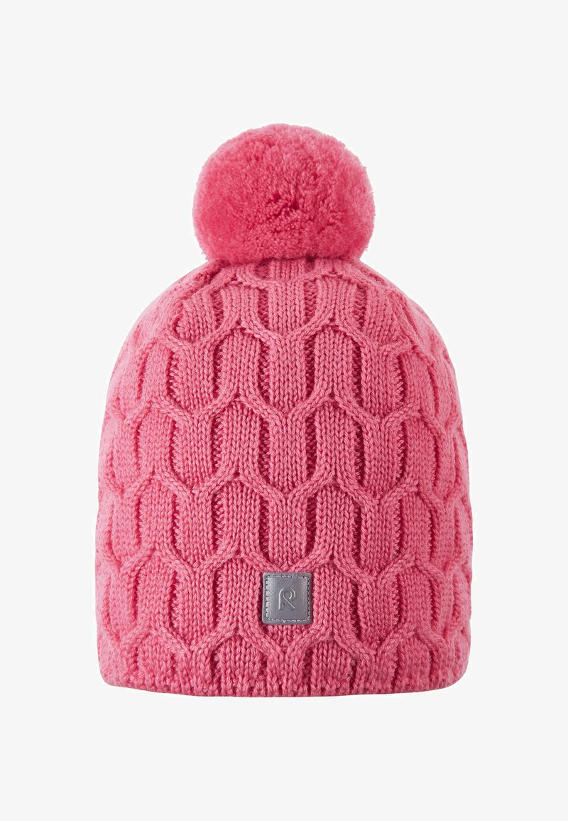 Pink knitted beanie with a textured diamond pattern, featuring a fluffy pom-pom on top and a rectangular logo patch on the side.