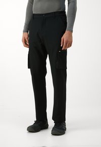 Black cargo pants with side pockets, made from lightweight material. Features a button closure and fitted design for a streamlined look.