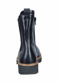 Schwarze Lederknöchelstiefel mit einem strukturierten Rückenteil, seitlichem Reißverschluss und einer strapazierfähigen Gummisohle mit gerippten Akzenten für besseren Halt.