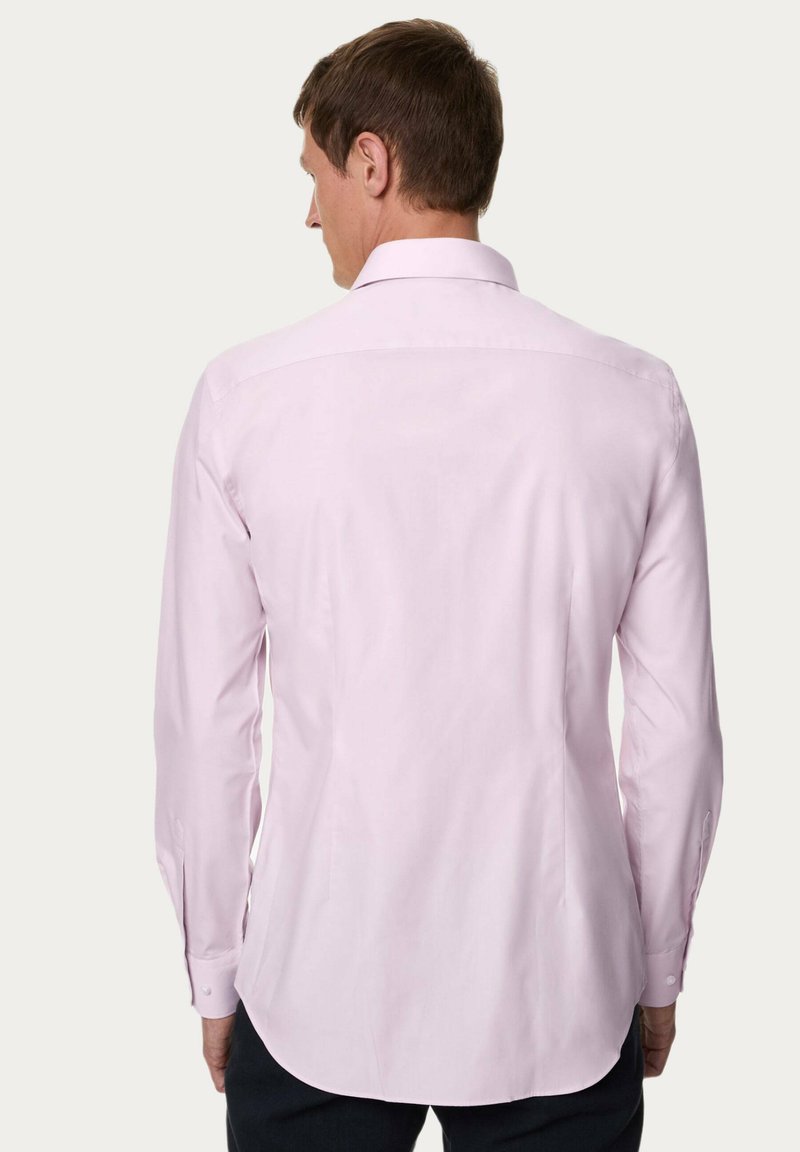 Haut en coton biologique gaufré à col boutonné et manches longuesblanc éclatant pour Homme | FR