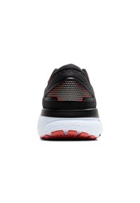 Scarpa sportiva nera con una tomaia testurizzata, contrasti di colore rossi, una suola bianca imbottita e un tallone in rete con motivo.