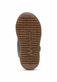 Gummisko sula med texturerat greppmönster, i råtannfärg och med en logotyp i mitten. Sidan har en slät, mörk överdel.