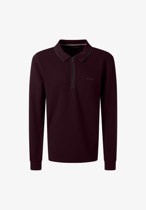 Donker bordeauxrode polo met lange mouwen, voorzien van een ritssluiting aan de voorkant, geribbelde manchetten en een subtiele merkl logo op de linkerkant van de borst.