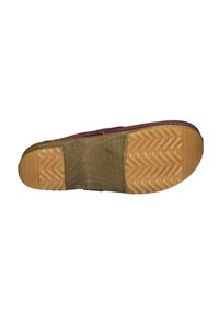 Rubber sole with a textured herringbone pattern, featuring a burgundy upper. The sole shows signs of wear, with a smooth, light brown section.