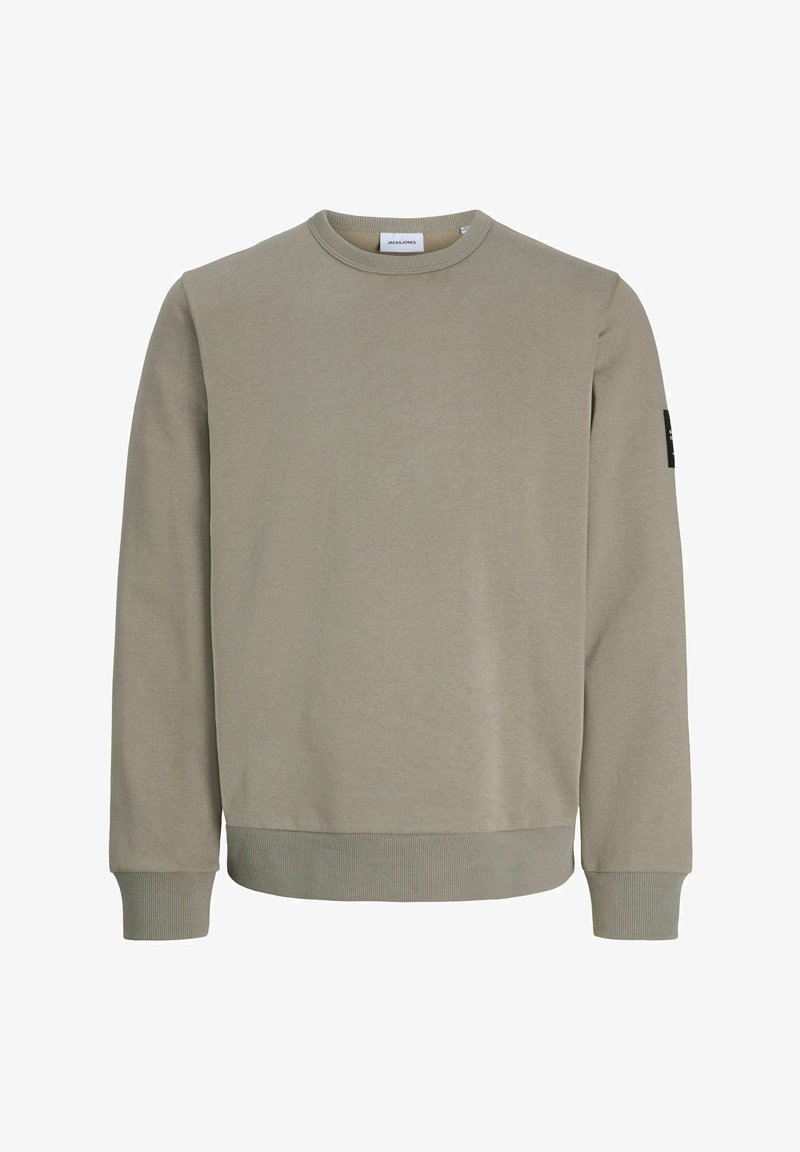 Sweat-shirt uni marron clair à manches longues avec col rond, poignets et ourlet côtelés, avec une petite étiquette logo sur la manche supérieure gauche.