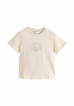 Cream short-sleeve cotton t-shirt with round neck and embroidered shell design centered on the chest.