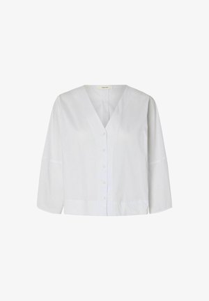 Valge pikamaa varrukatega pluus V-kaeluse ja eesmist nuppudega, vaba lõikega ja kergelt lai hem.