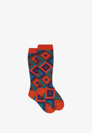 Knee-high socks featuring a geometric diamond pattern in orange, turquoise, brown, and purple; solid orange cuffs and soles.