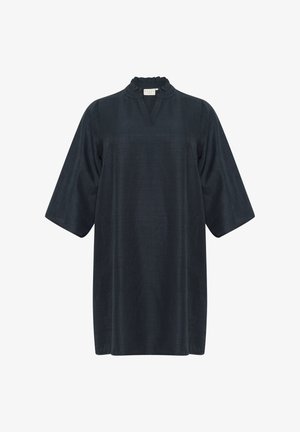 Tunika tummansinisestä väristä, jossa on venepääntie, lyhyet leveät hihat ja väljä istuvuus; valmistettu sileästä kankaasta, jossa on hienovarainen rakenne.