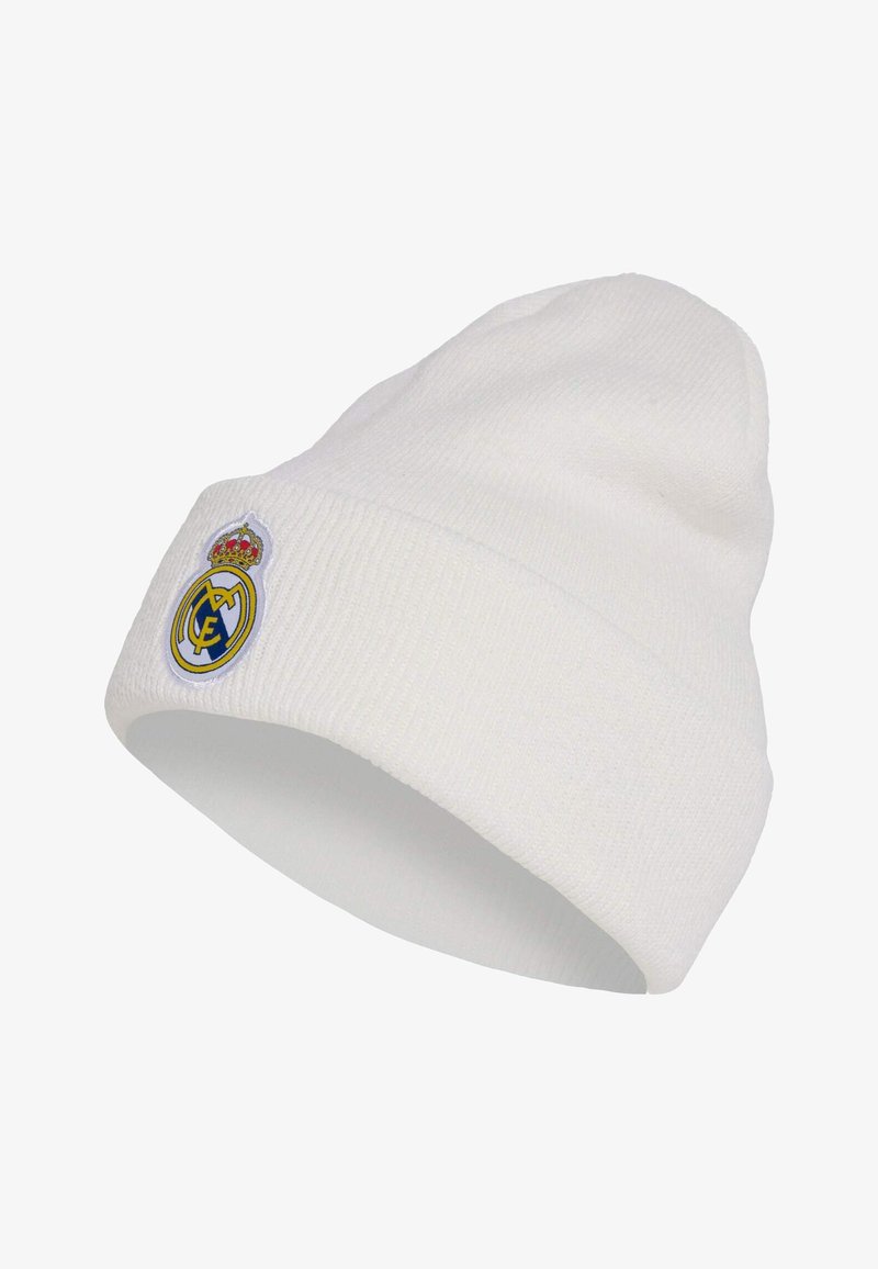 Bonnet blanc en maille avec revers plié et logo circulaire brodé du club de football du Real Madrid.