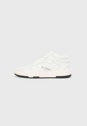White high-top sneakers with a textured finish, featuring a black rubber sole, subtle logo detail, and a layered design.