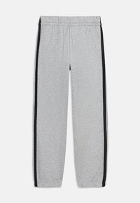 Gray sweatpants made of soft fabric, featuring a black side stripe, elastic waistband, and tapered legs.