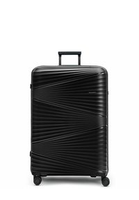 Valigia rigida nera con un design geometrico ondulato, manico retrattile e quattro ruote per la mobilità. Superficie liscia e materiale resistente.