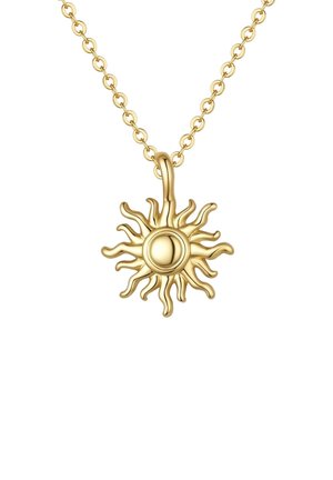 Collier en chaîne dorée avec un pendentif en forme de soleil présentant des rayons ondulés et un centre circulaire lisse.