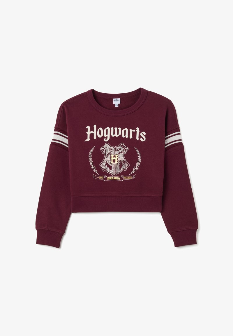 Bordeaux cropped sweatshirt met witte strepen op de mouwen, met de tekst "Hogwarts" en het ontwerp van het wapenschild in goud en zwart. Katoenen materiaal.