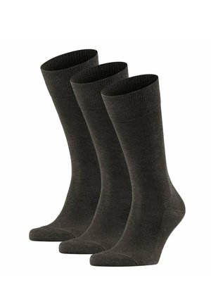 Drei Paar schlichte dunkelgraue Crew-Socken, die aufrecht vor einem weißen Hintergrund stehen.