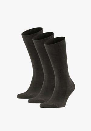 Drei Paar schlichte dunkelgraue Crew-Socken, die aufrecht vor einem weißen Hintergrund stehen.