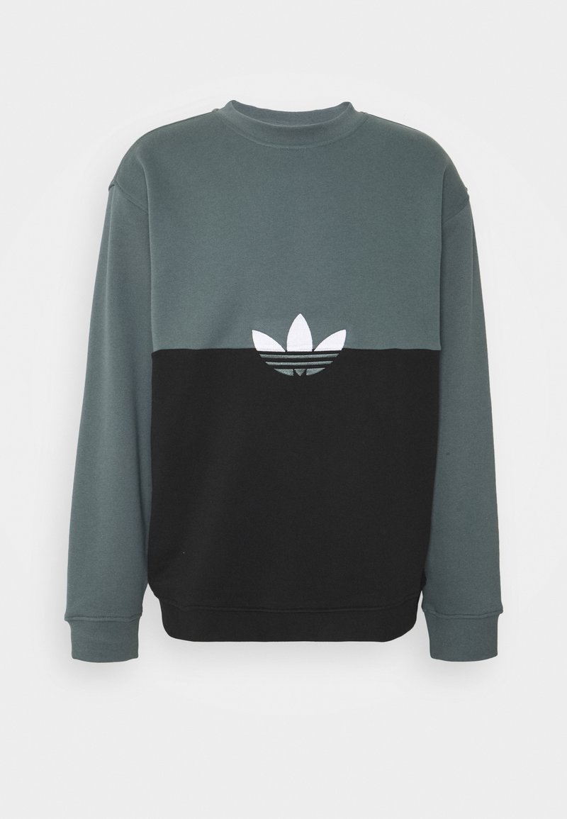 Zeleno-černá mikina s kulatým výstřihem. Na hrudi je bílý vyšívaný logo. Měkká látka, volný střih a dlouhé rukávy.