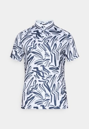 Valgest polo-särgist, millel on meresinise abstraktse laine muster, punktkollane krae, kolme nupuga kangas ja lühikesed varrukad.