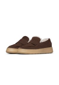Brown suede slip-on shoes with a cream faux fur lining, featuring a rubber tan sole and stitched detailing on the upper.