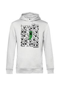 Biała bluza z kapturem z centralnym motywem zielonego Creepera wśród wielu czarno-białych pikselowych twarzy, wykonana z miękkiego materiału.