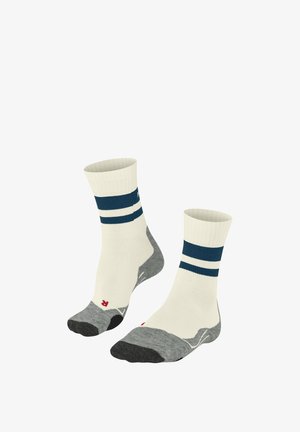 Chaussettes montantes crèmes avec des rayures navy, présentant un orteil et un talon gris. Le matériau semble doux avec une texture côtelée sur le haut.
