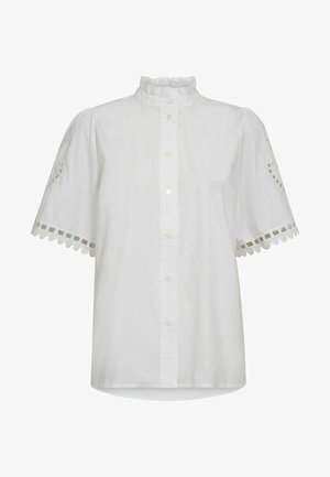 Bílá košile s límečkem s volánky; krátké nabírané rukávy s vyšívanými detaily a vykrojenými lemy; zapínání na knoflíky v přední části.