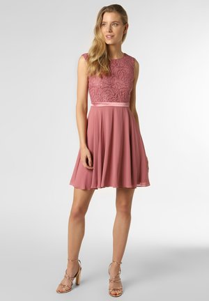 Pink lace dress with a fitted bodice, circular skirt, and a satin waistband. The dress features a smooth, flowing texture and sleeveless design.